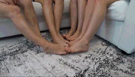 4 gerls crossed  legs and interlocking their toes together a