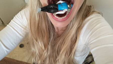 School girl plays with tiny on bench