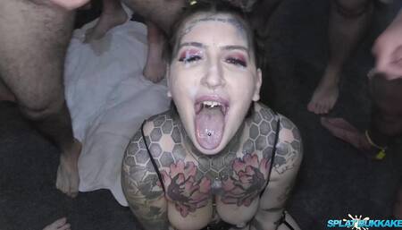Inked slut Pixie Peach enjoys a bukkake with Maddison Black