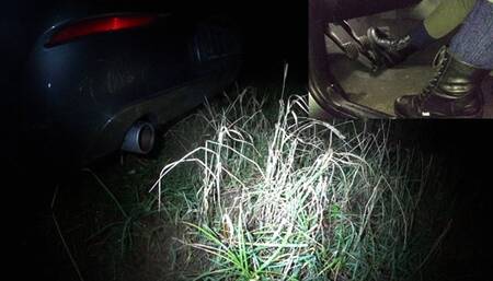 Ms Curious revving the BMW in Dockers boots