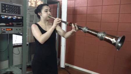 Natasha Blows 3 Sizes of Tibetan Horns (MP4 - 720p)