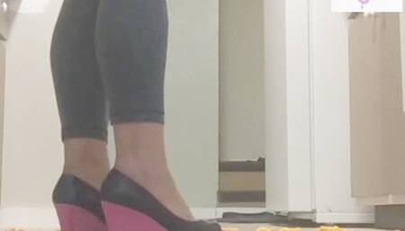 Pink skull crush wedges carelessly flatten cheeziz in kitchen