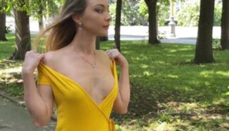 Yelow dress. Topless walk. Beautiful woman expose her tits in public.
