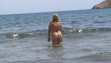 Julie Cunningham nude on a beach walking into sea.wmv