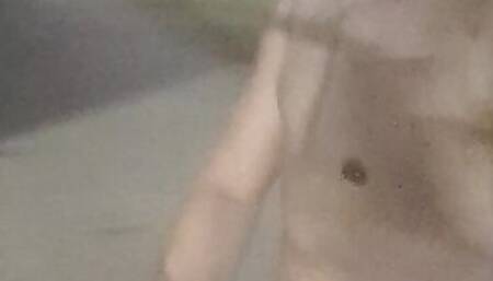 Sexy hunky jock walks around a plaza naked outside in public