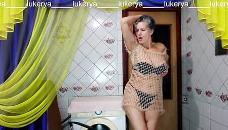 Hot housewife Lukerya having fun flirting in the kitchen. Easy home striptease of an old woman on a webcam online.