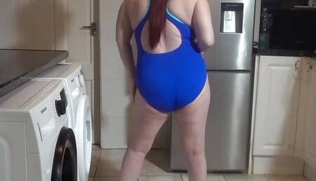 wife dancing sexy blue in swimsuit and sneakers