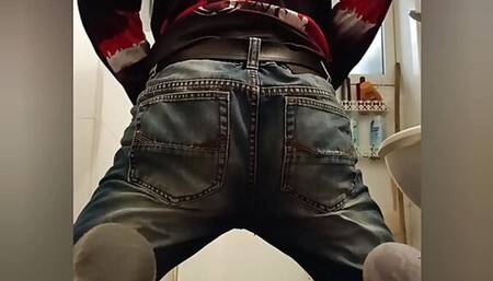 Jeans boy striptease in public toilet