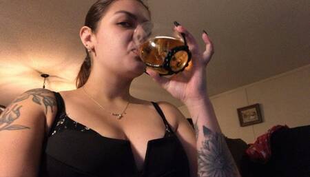 Giantess enjoys teeny flavored drink