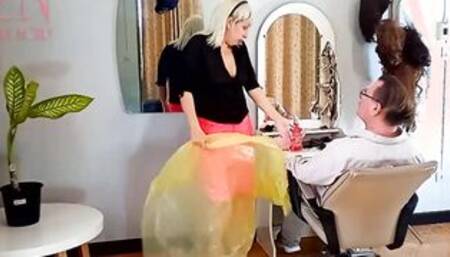 Nudist barbershop. Naked lady hairdresser into an apron. Voyeur camera. The client is surprised. one