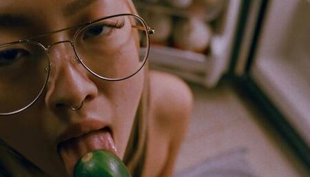 Hungry teen fucks herself with a cucumber while sucking cock for some extra protein
