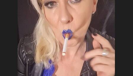 Exquisite power smoking with Marlboro Red 100 in leather and mystic blue lipstick