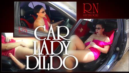 A lady masturbates in a car in a parking lot Teasing a clit with a dildo Depraved slut masturbates outdoors in city near