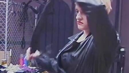 Leather-clad dominatrixes restrain and punish male slave in BDSM chamber