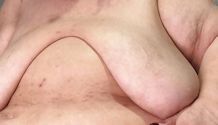 Granny with gigantic tits touching her very horny bbw body