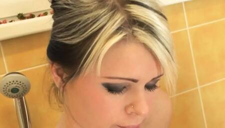 She masturbates in the bathroom and then her husband licks her