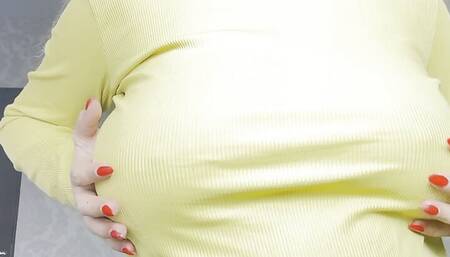 Sexy pregnant blonde teasing with big boobs