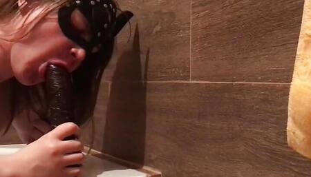 Masked sissy worships BBC in a bathroom