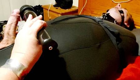 Man strapped down in neoprene sleepsack 3- BBW domination,BBW Bondage,man in bondage,male bondage,sleep sack,backboard,amateur,strapped down,bound and gagged man,man tied up,wand,edging,edged,