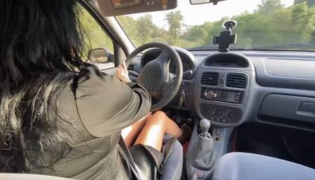 Mme Georgia drives and plays with the car in Black Sandal - Over shoulder view