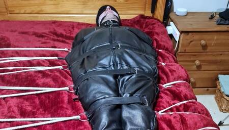 Handjob on a man in sleepsack by woman 1-BBW domination,BBW bondage,man in bondage,male bondage,man tied up,leather sleepsack,sleep sack,amateur, bound and gagged man,bed bound,handjob,cock and balls tied,edging,edged,
