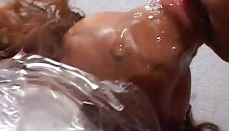 Dude has his own black doll wrapped in cellophane ready to use for a fuck session