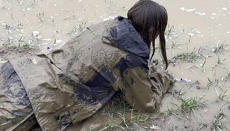 Muddy fields, rain suit in the rain