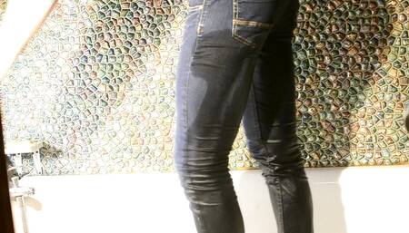 Wetting myself in jeans in bathroom...
