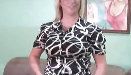 Striptease from a hot sexy blonde with huge tits