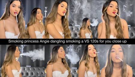 Smoking princess Angie dangling smoking a VS 120s for you close up in a lovely white dress! Nose exhales, multi pumps, side view