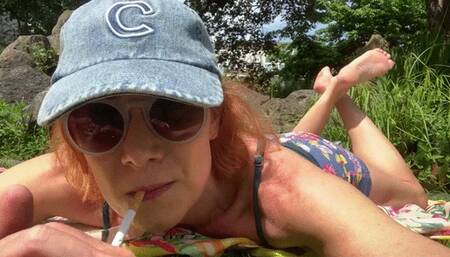 Barefoot smoke in the park