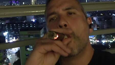 Uncut daddy smokes cigar and jerks on balcony PREVIEW