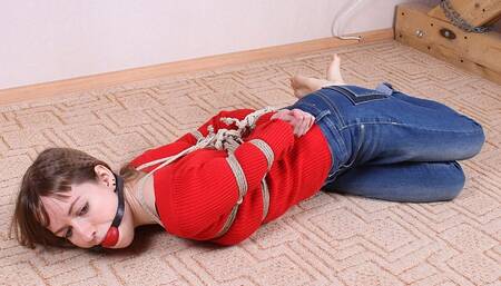 Ballgagged barefoot Agnes in red sweater and jeans, hogtied with hemp rope, rolls and wiggles on the floor (HD MP4)