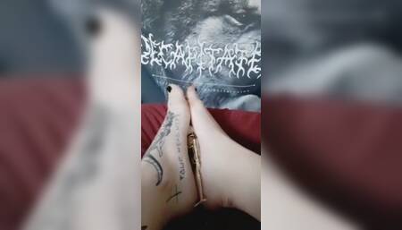 Giantess crushes tiny man between her tattooed feet