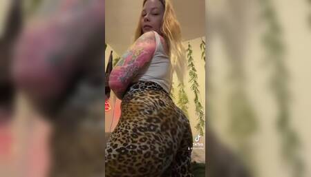 Curvy blonde burping in leggings
