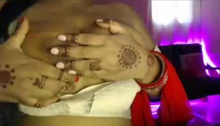 Hot desi girl massaged her breasts and pressed her breasts and sucked the nipples in her mouth.