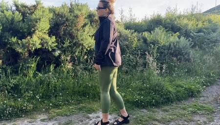 Girl in leggings peeing outdoor