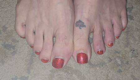 Wiggling red toes with closeup