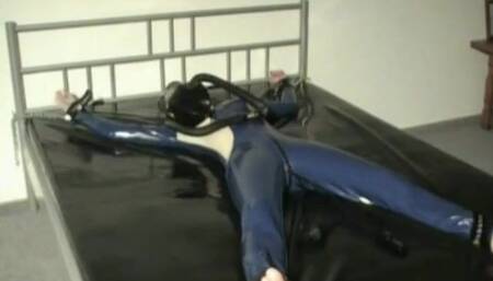 Latex Girl Sub Bondage In The Rubber Bed With Heavy Latex Gas Mask