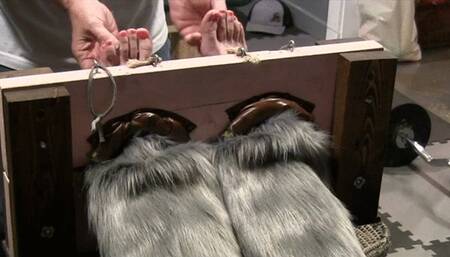 Pinky in for some up close foot tickling in the stocks!