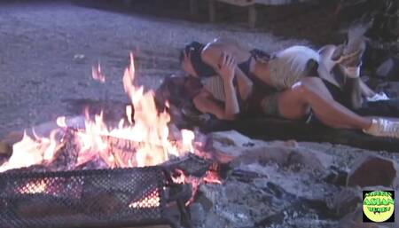 Two Attractive Lesbians Passionately Kiss and Touch Their Pussies Next to the Campfire