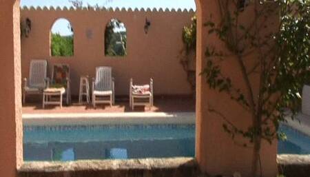 On the table by the hotel pool