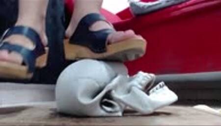 try to press a very hard skull in wooden sandals