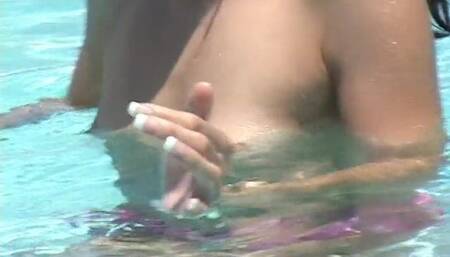 Two teen cuties doing 69 position on an outdoor swimming pool fuck