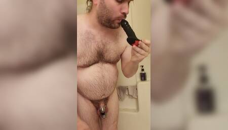 Light teasing in the shower with cock cage