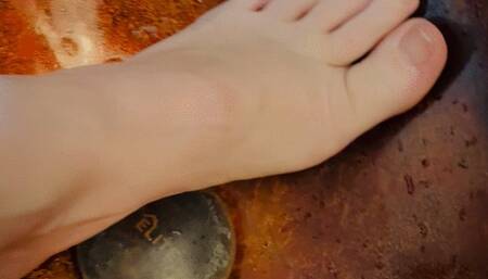 Nefariess washes her feet and clips and paints her toenails