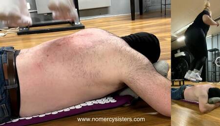 Sisters tearing skin with spiked mat on his chest and Fila's on his back