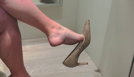 Bare legs sparkly nude shoe changing room dangle