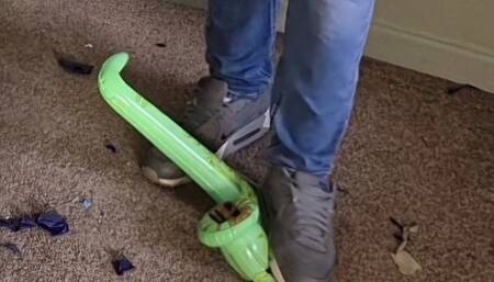 Tom pops some mini inflatables