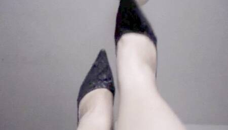 Showing off long nails, legs and high heels